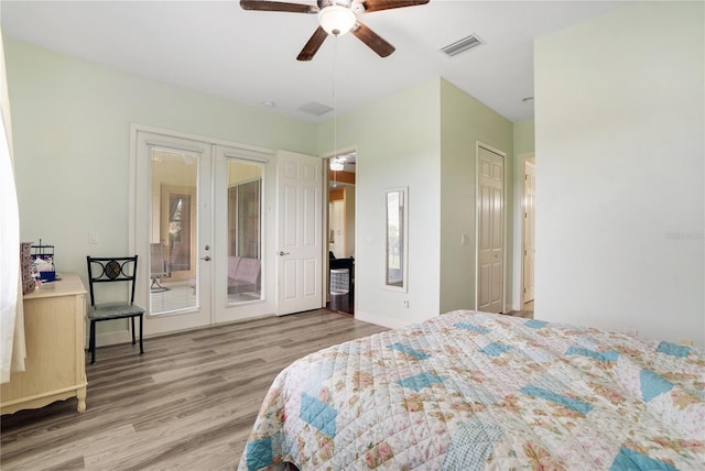 bedroom featuring ceiling fan, wood-type flooring, access to outside, and french doors