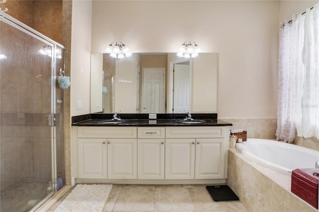 bathroom with separate shower and tub, tile patterned flooring, and vanity