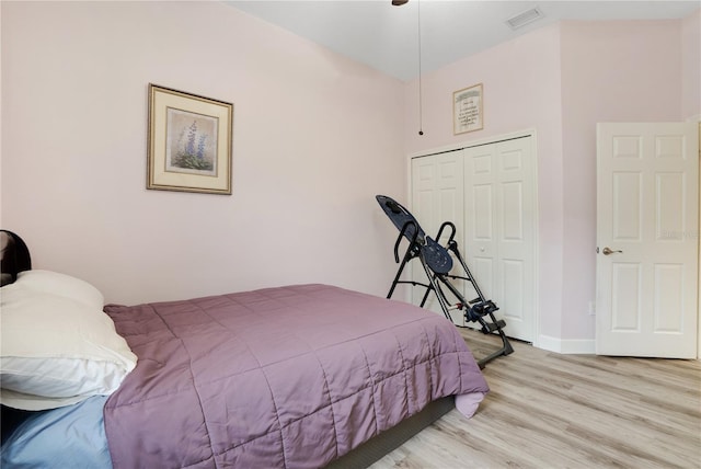 bedroom featuring a closet and light hardwood / wood-style flooring