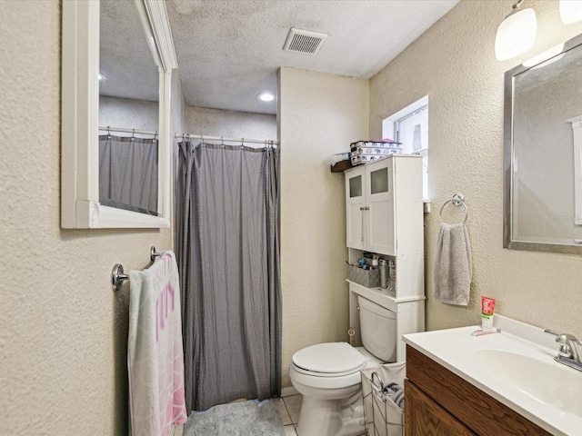 bathroom featuring vanity, a textured ceiling, toilet, and a shower with shower curtain