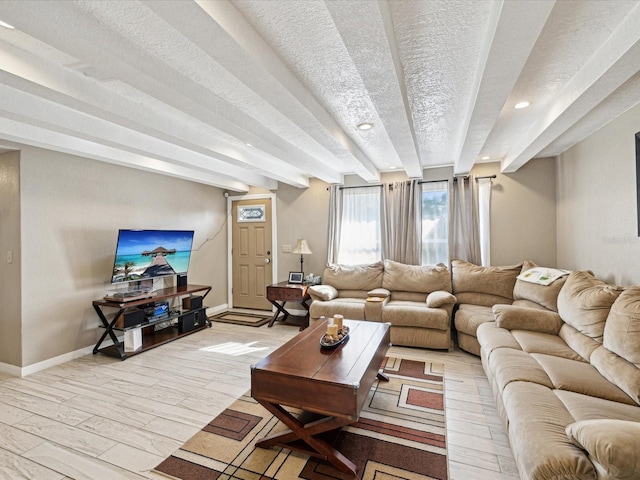 living room featuring a textured ceiling and light hardwood / wood-style flooring