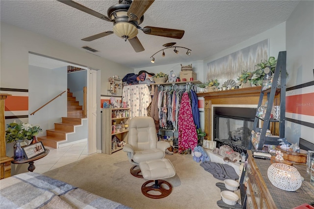 interior space with light colored carpet and a textured ceiling