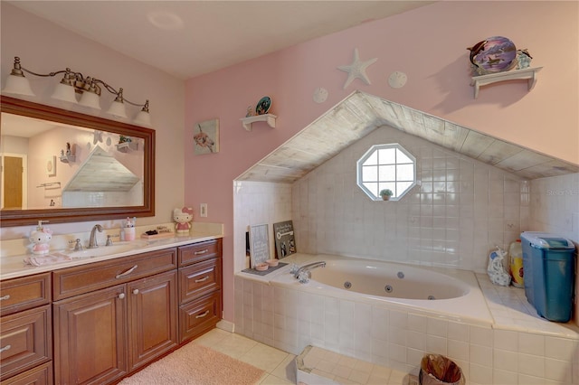 bathroom featuring tile patterned flooring, vanity, and tiled bath