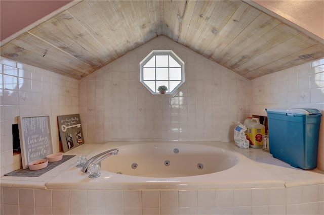 bathroom with a relaxing tiled tub, wooden ceiling, and lofted ceiling