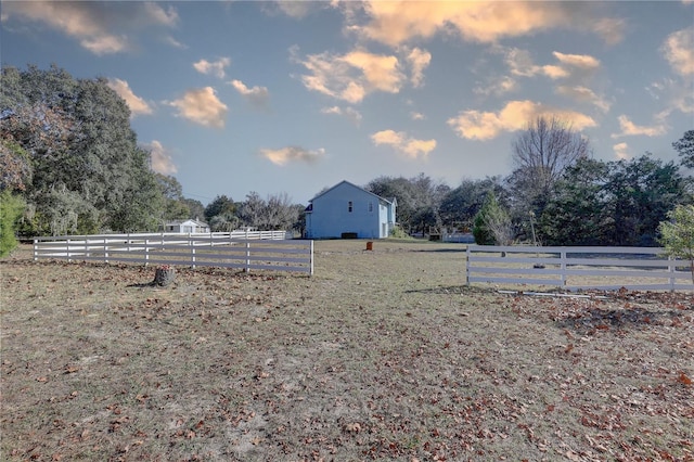 view of yard with a rural view