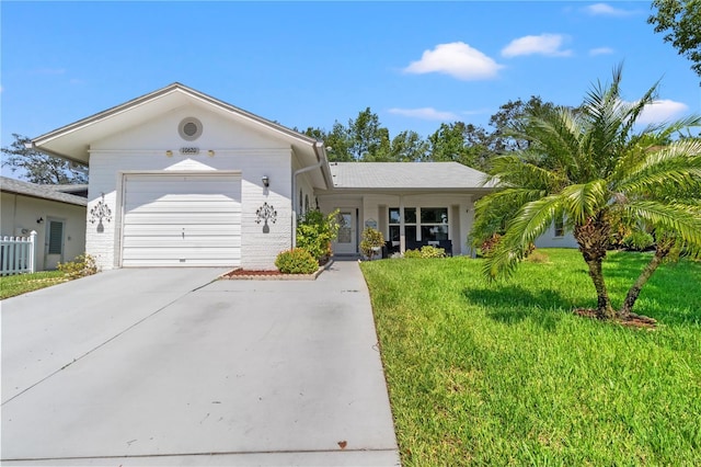 ranch-style house with a front yard and a garage