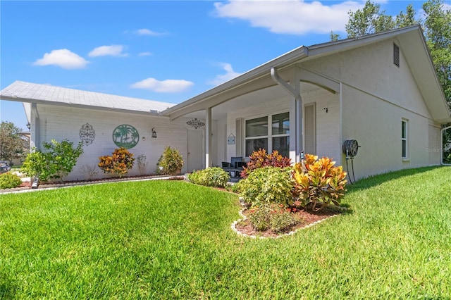 single story home with a front yard and a porch