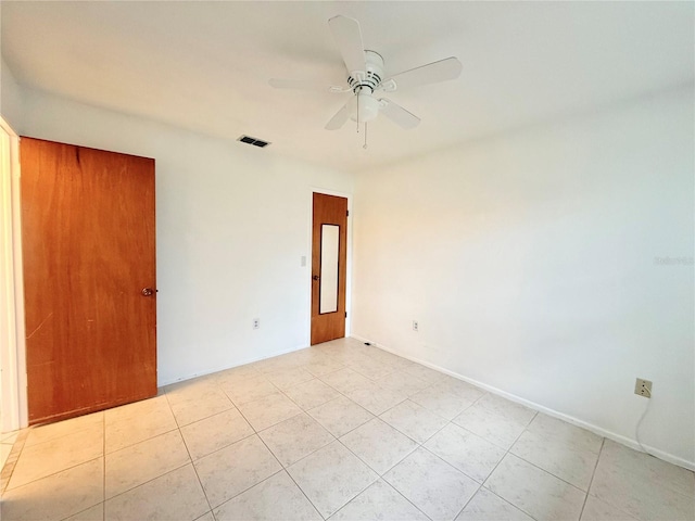 unfurnished room featuring ceiling fan and light tile patterned flooring