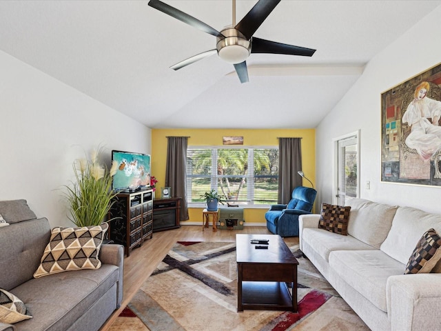 living room with light wood-type flooring, vaulted ceiling, and a ceiling fan