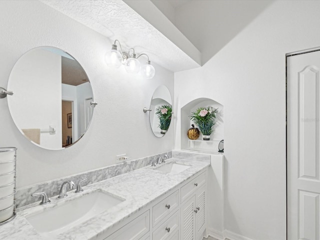 full bath with double vanity and a sink