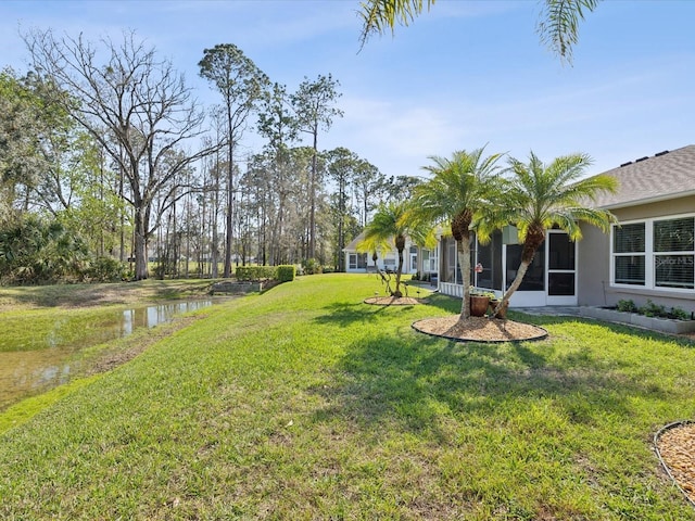 view of yard featuring a water view