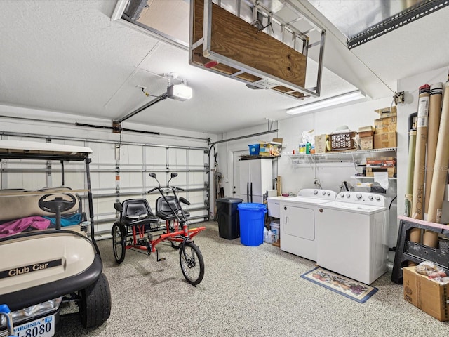 garage featuring washing machine and dryer and a garage door opener