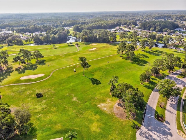 aerial view featuring golf course view and a water view