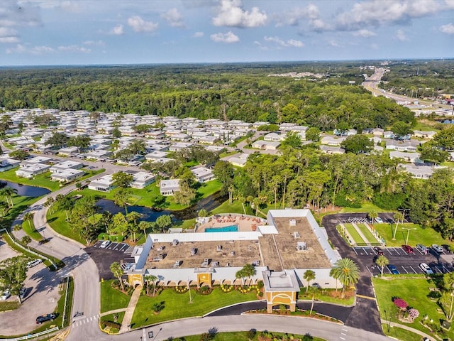 aerial view with a residential view and a view of trees