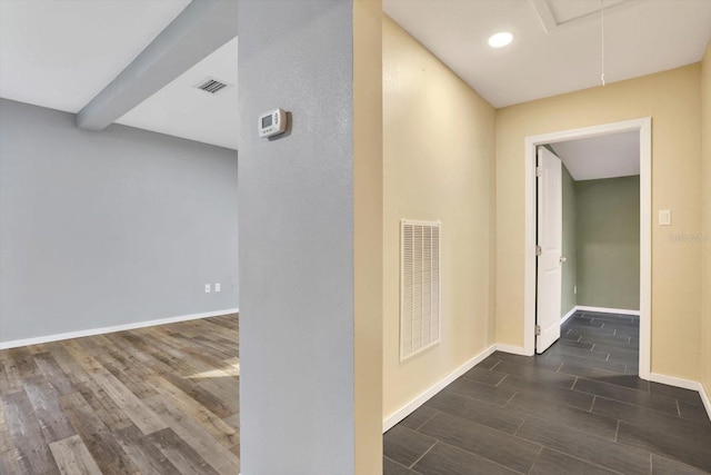 corridor with dark wood-type flooring