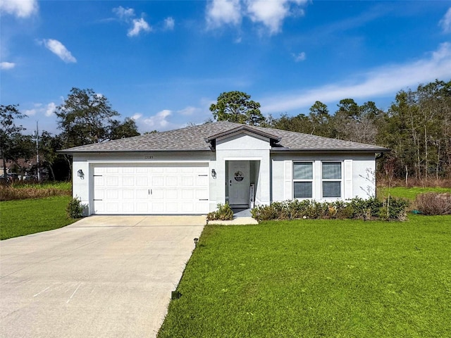 ranch-style home featuring a garage and a front lawn