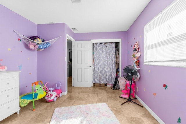 bedroom featuring light tile patterned flooring