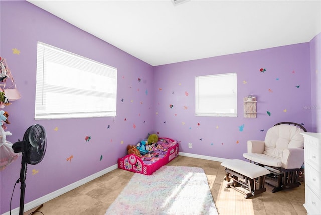 bedroom featuring multiple windows