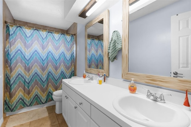 bathroom featuring a shower with curtain, tile patterned flooring, vanity, and toilet