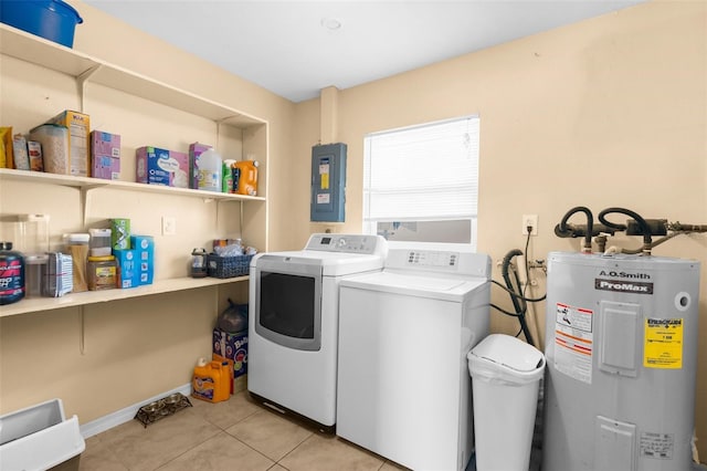 clothes washing area featuring separate washer and dryer, light tile patterned floors, electric panel, and water heater