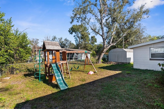 view of playground with a lawn