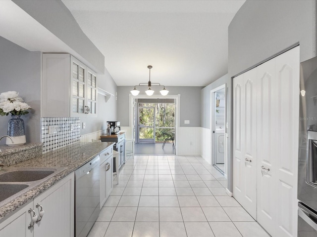 kitchen featuring white cabinets, decorative light fixtures, light stone countertops, and dishwasher