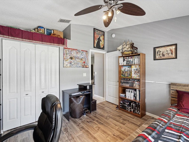 office space with ceiling fan and light wood-type flooring