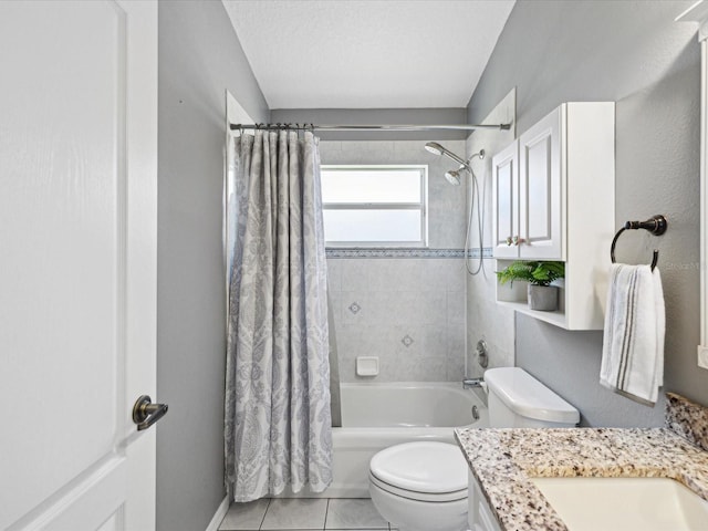 full bathroom with shower / bath combination with curtain, vanity, a textured ceiling, tile patterned flooring, and toilet