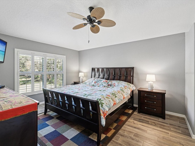 bedroom featuring ceiling fan and light wood-type flooring