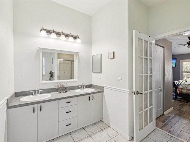 bathroom featuring ceiling fan and vanity