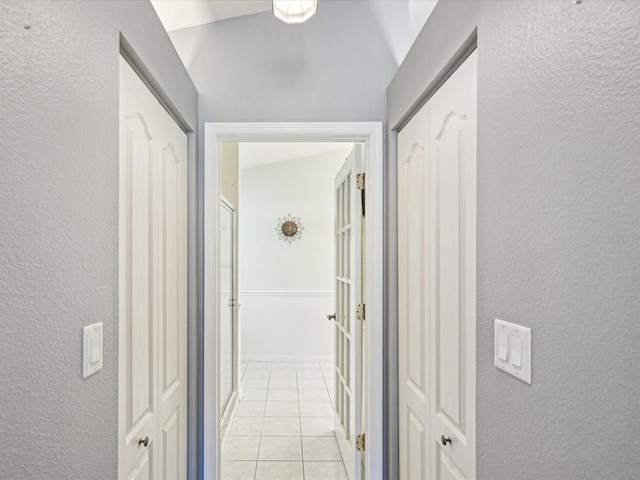 hallway with light tile patterned floors