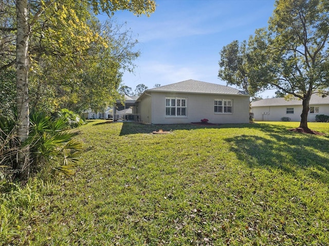 back of house featuring a yard