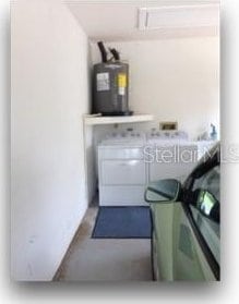 laundry area with electric water heater