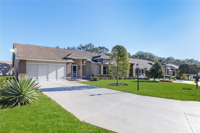 view of front of house featuring a front lawn and a garage