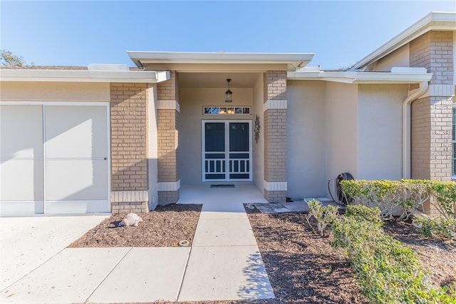 doorway to property with a garage