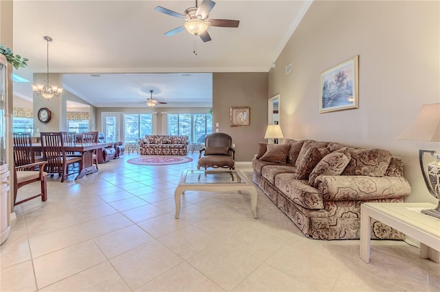 tiled living room featuring crown molding, ceiling fan with notable chandelier, and lofted ceiling