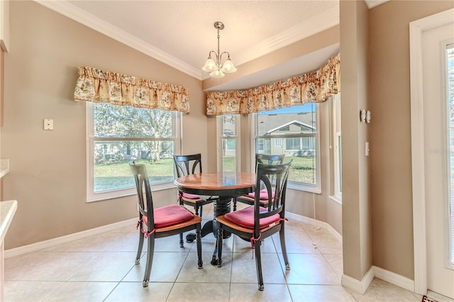 tiled dining area with crown molding, lofted ceiling, and an inviting chandelier