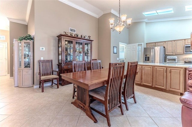 tiled dining area featuring high vaulted ceiling, an inviting chandelier, and crown molding