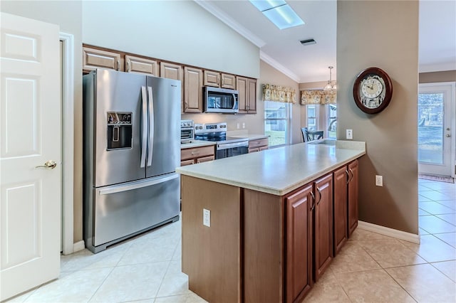 kitchen featuring kitchen peninsula, appliances with stainless steel finishes, crown molding, lofted ceiling, and light tile patterned flooring