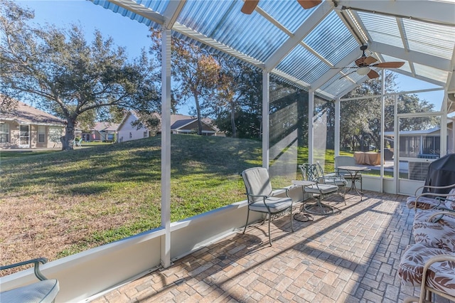 sunroom / solarium with ceiling fan