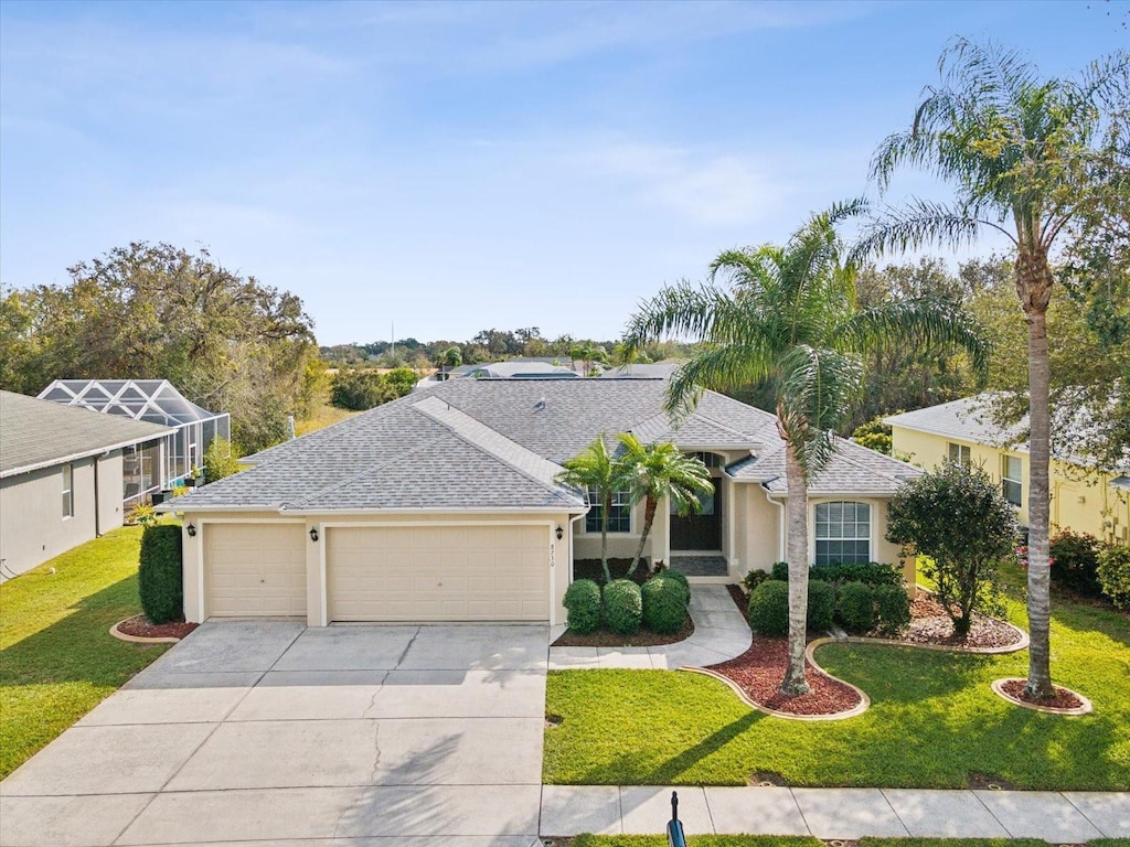 ranch-style house with a front lawn and a garage