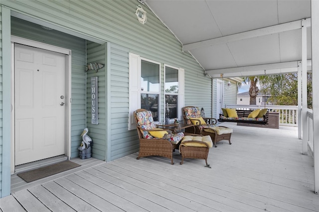 wooden deck featuring covered porch