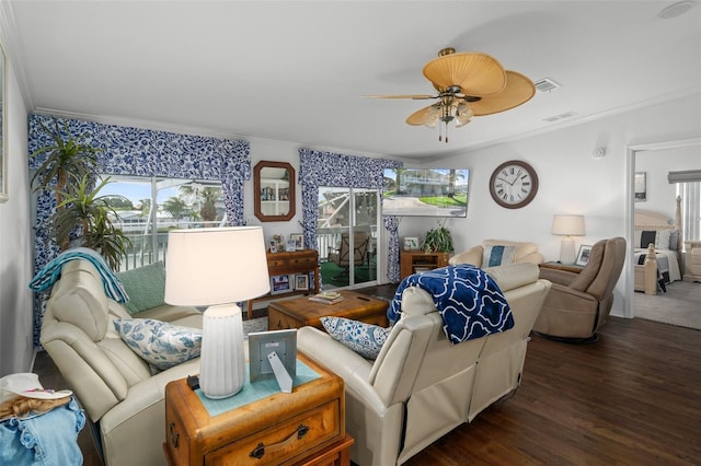 living room with ceiling fan, dark wood-type flooring, and ornamental molding