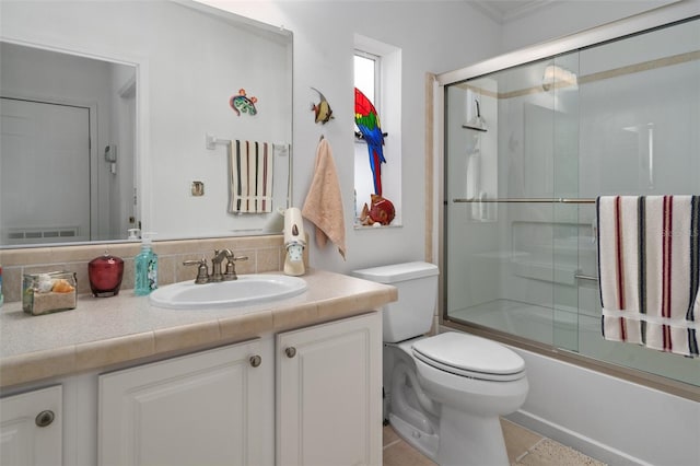 full bathroom with enclosed tub / shower combo, backsplash, tile patterned floors, toilet, and vanity