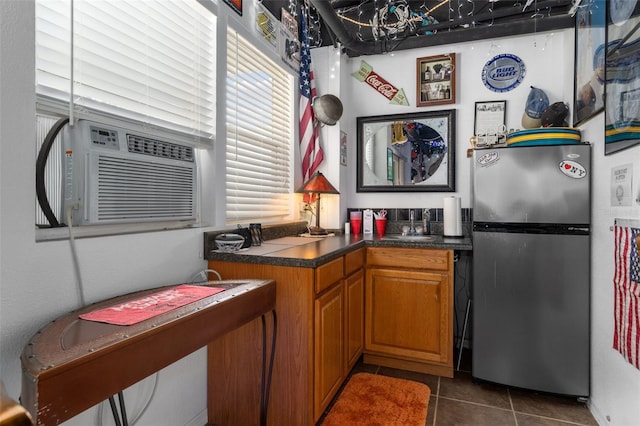 kitchen with dark tile patterned flooring, stainless steel fridge, and cooling unit