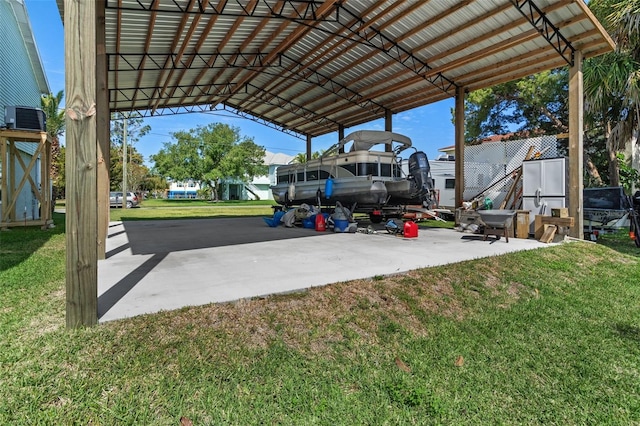 view of parking featuring a carport and a yard