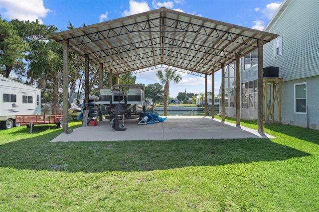 view of vehicle parking with a yard