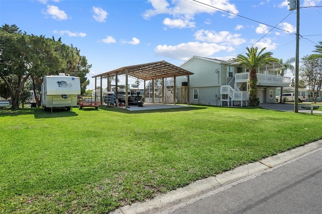 exterior space with a carport and a pergola