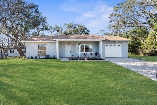 ranch-style home featuring a front lawn, a porch, and a garage