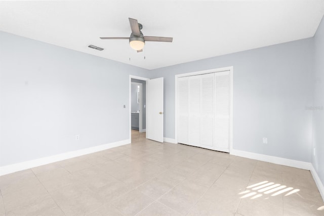 unfurnished bedroom featuring a closet, ceiling fan, and light tile patterned flooring